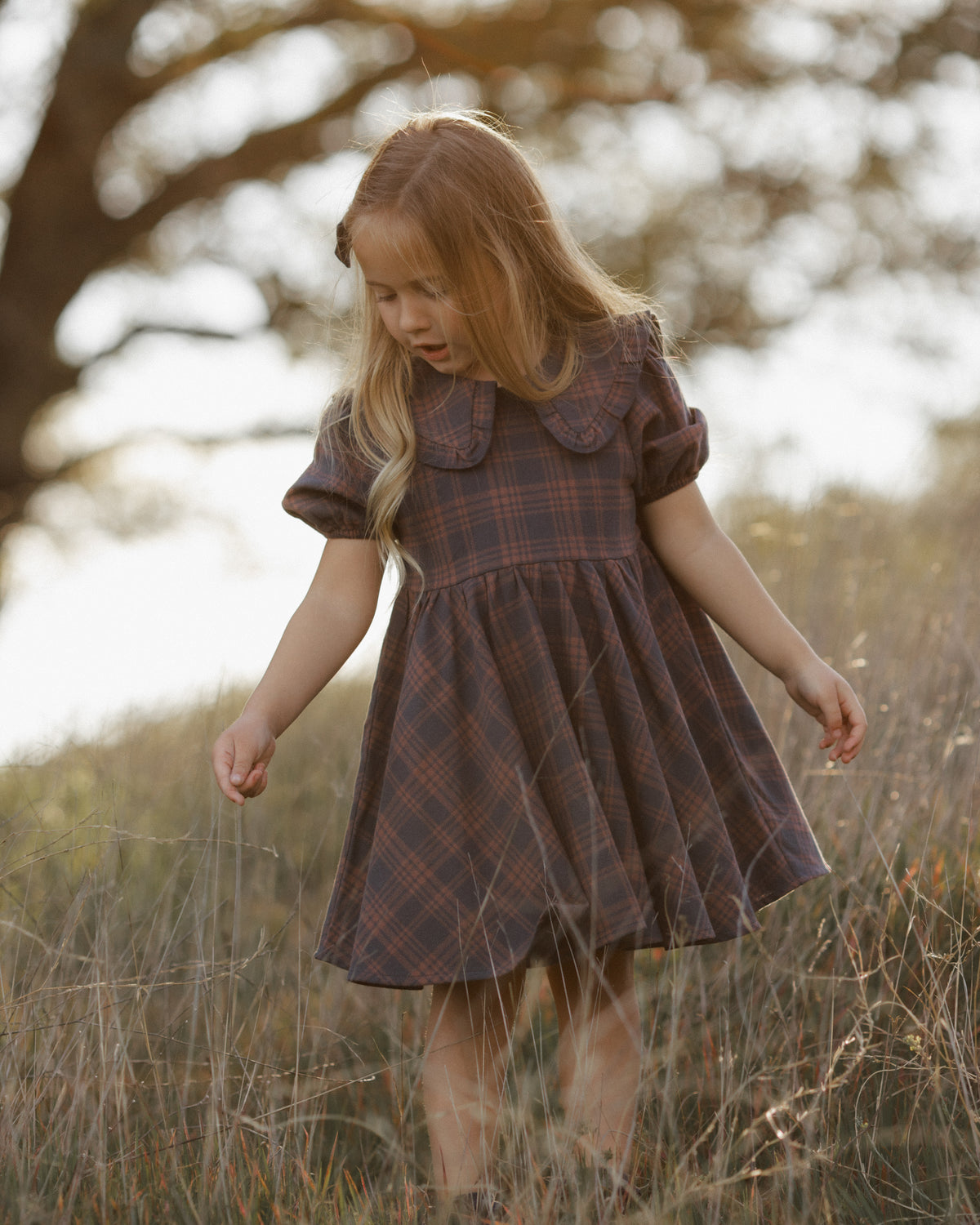 Girl wearing the Rylee + Cru Camille Dress in "Midnight Plaid"