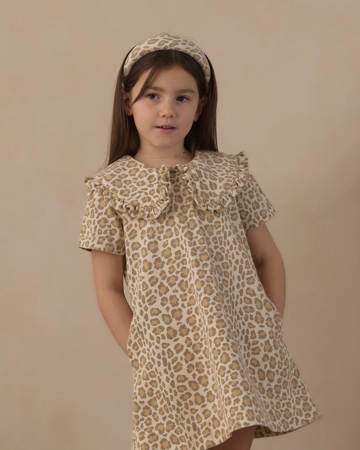 Girl wearing the Rylee + Cru Girls Collard Denim Mini Dress | Leopard and matching headband