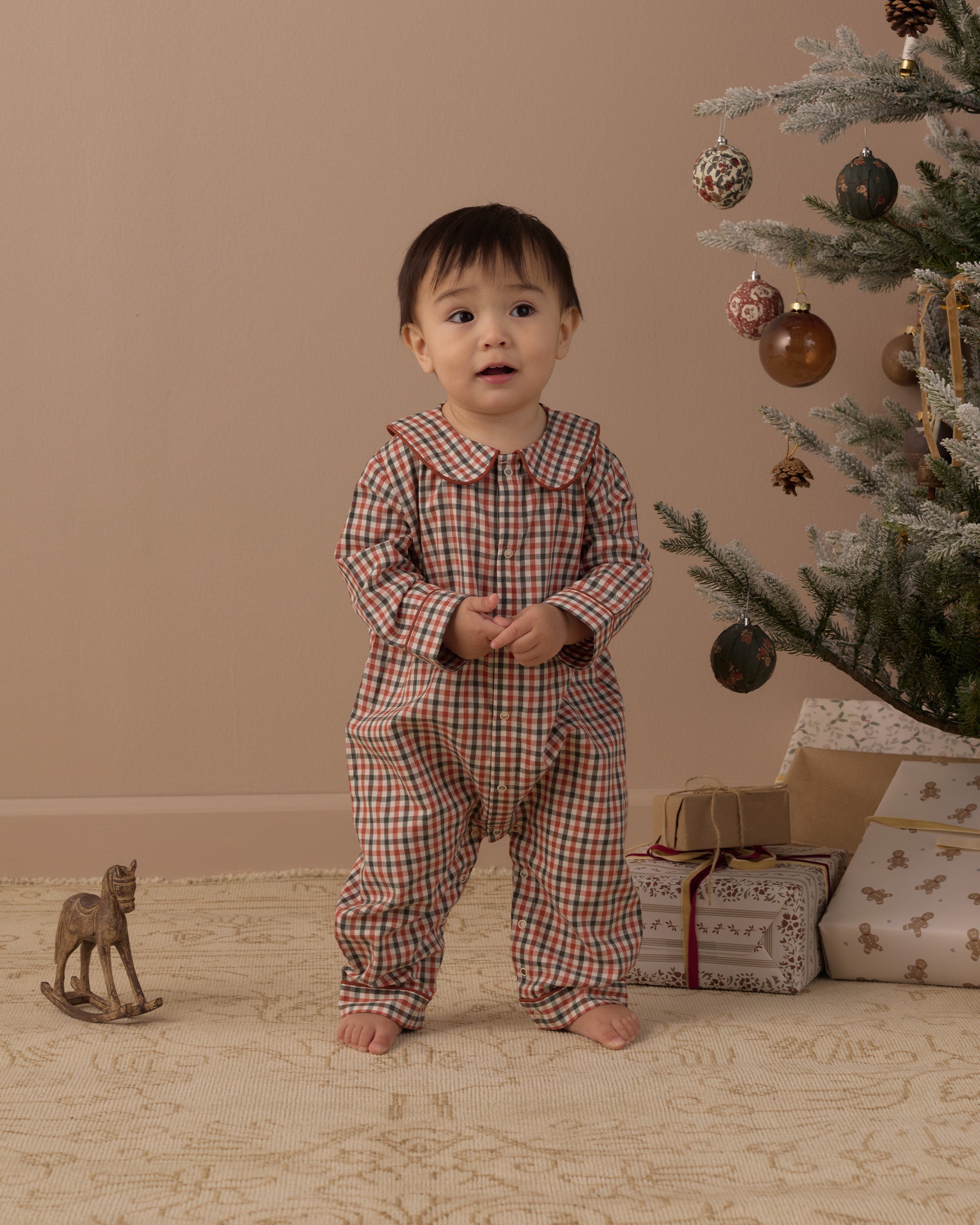 Studio model Rylee + Cru Baby Pajama Romper | Holiday Gingham 