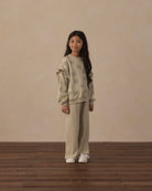 Young girl wearing the Ruffle Sweatshirt | Big Daisy from Rylee + Cru front
