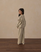 Girl wearing the Ruffle Sweatshirt | Big Daisy from Rylee + Cru, rear shot, looking over her shoulder