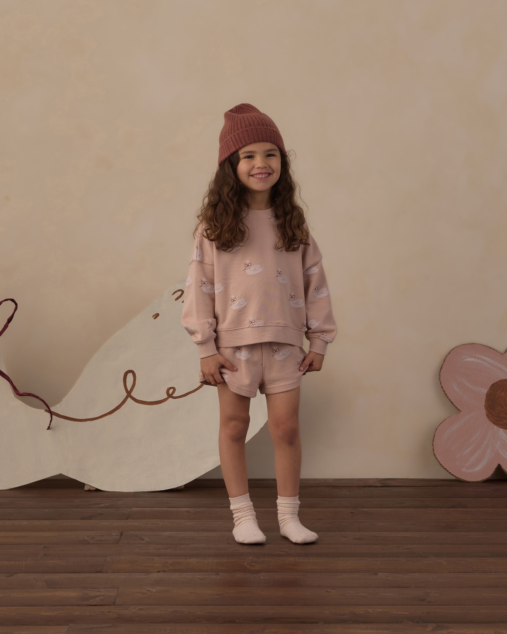 Smiling young girl wearing the Rylee + Cru Boxy Pullover | Swans