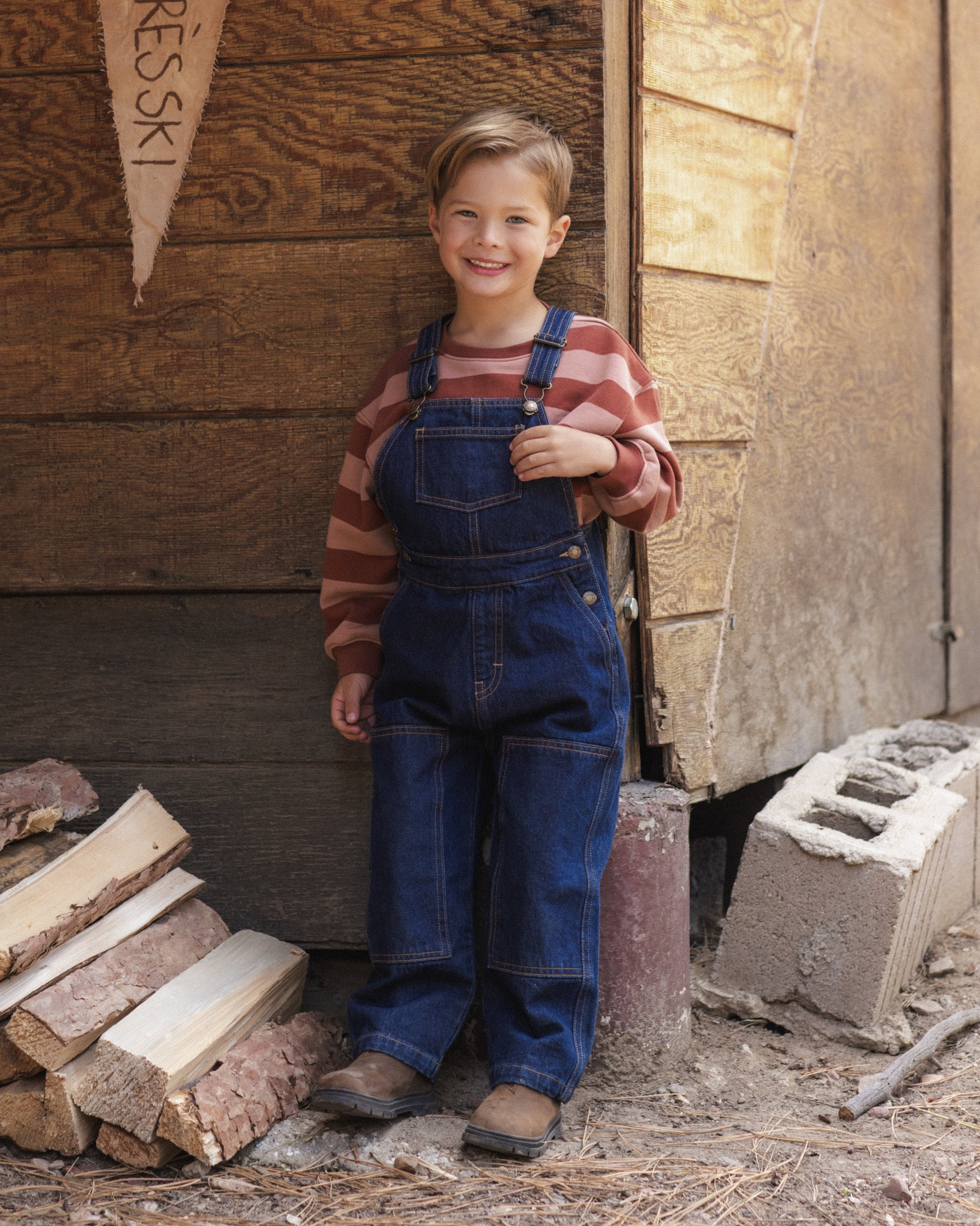 Boy modeling the Rylee + Cru Oversized Sweatshirt | Brick + Clay Stripe
