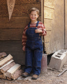 Boy modeling the Rylee + Cru Oversized Sweatshirt | Brick + Clay Stripe