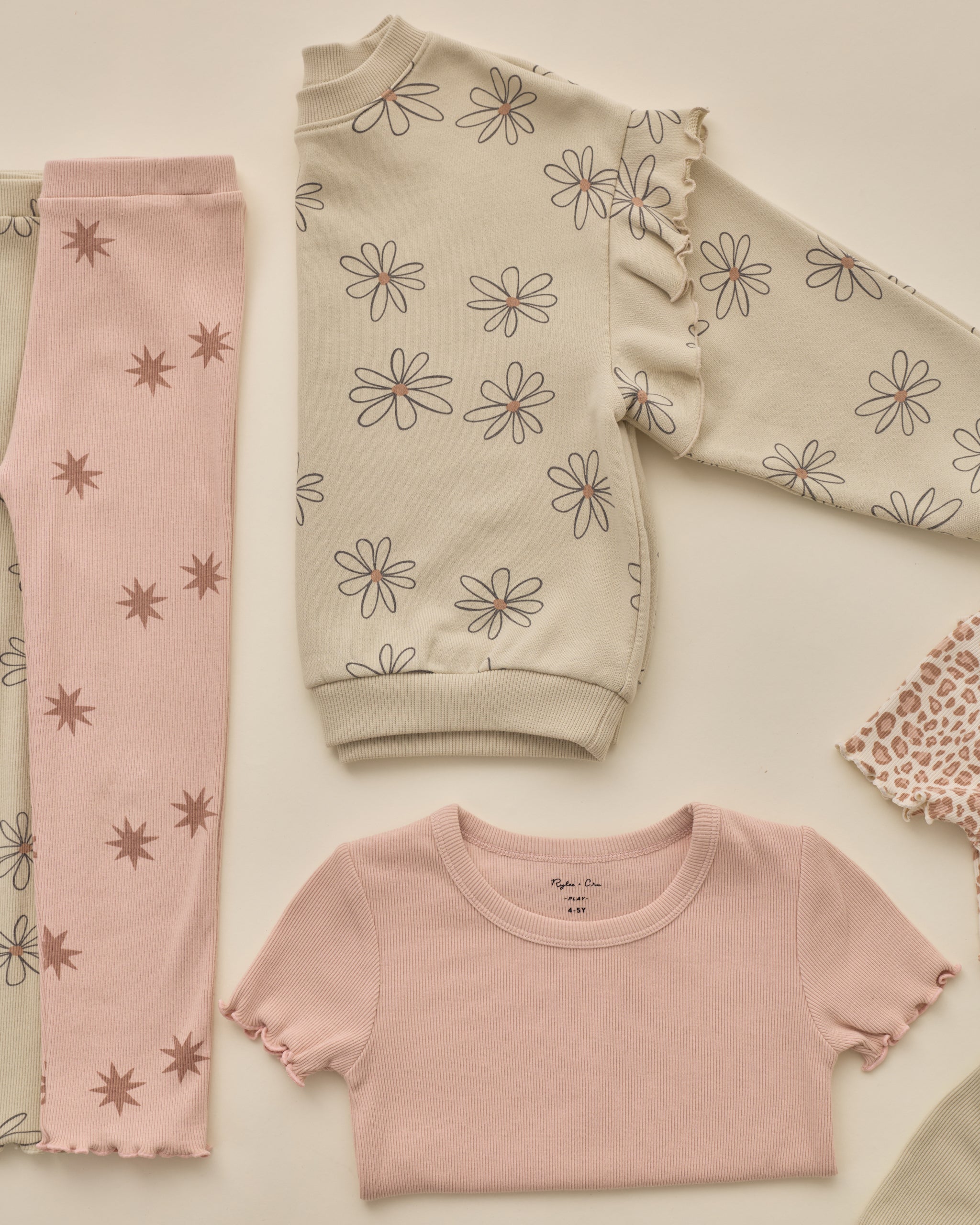 Styled flat lay of the Ruffle Sweatshirt | Big Daisy from Rylee + Cru and Rylee + Cru AW '26 Play Collection