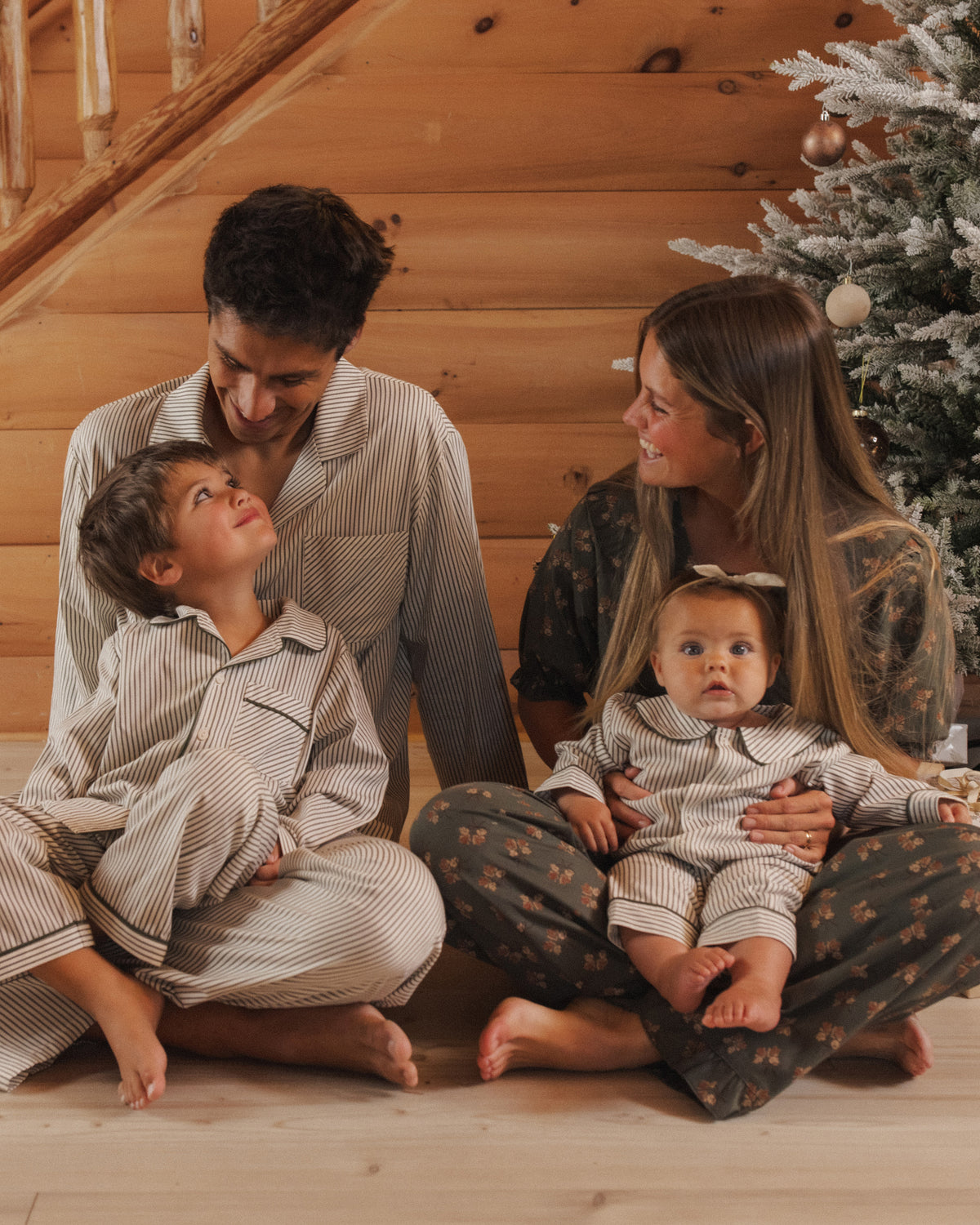 Lifestyle Models Rylee + Cru Men's Pajama Pant | Evergreen Stripe Family Pajamas and Rylee + Cru Boy's Long Sleeve Pajamas | Evergreen Stripes