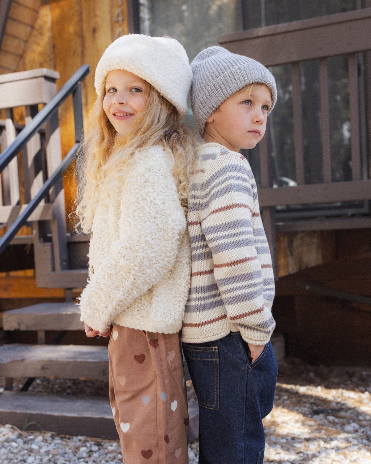 Girl and a boy standing outside. The boy is wearing the Rylee + Cru Jacques Sweater | Dusty Blue Stripe