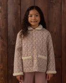 Girl modeling the Rylee + Cru Quilted Chore Coat in Primrose front detail shot