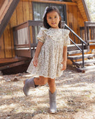 Girl wearing the Rylee + Cru Winnie Dress | Winter Garden front