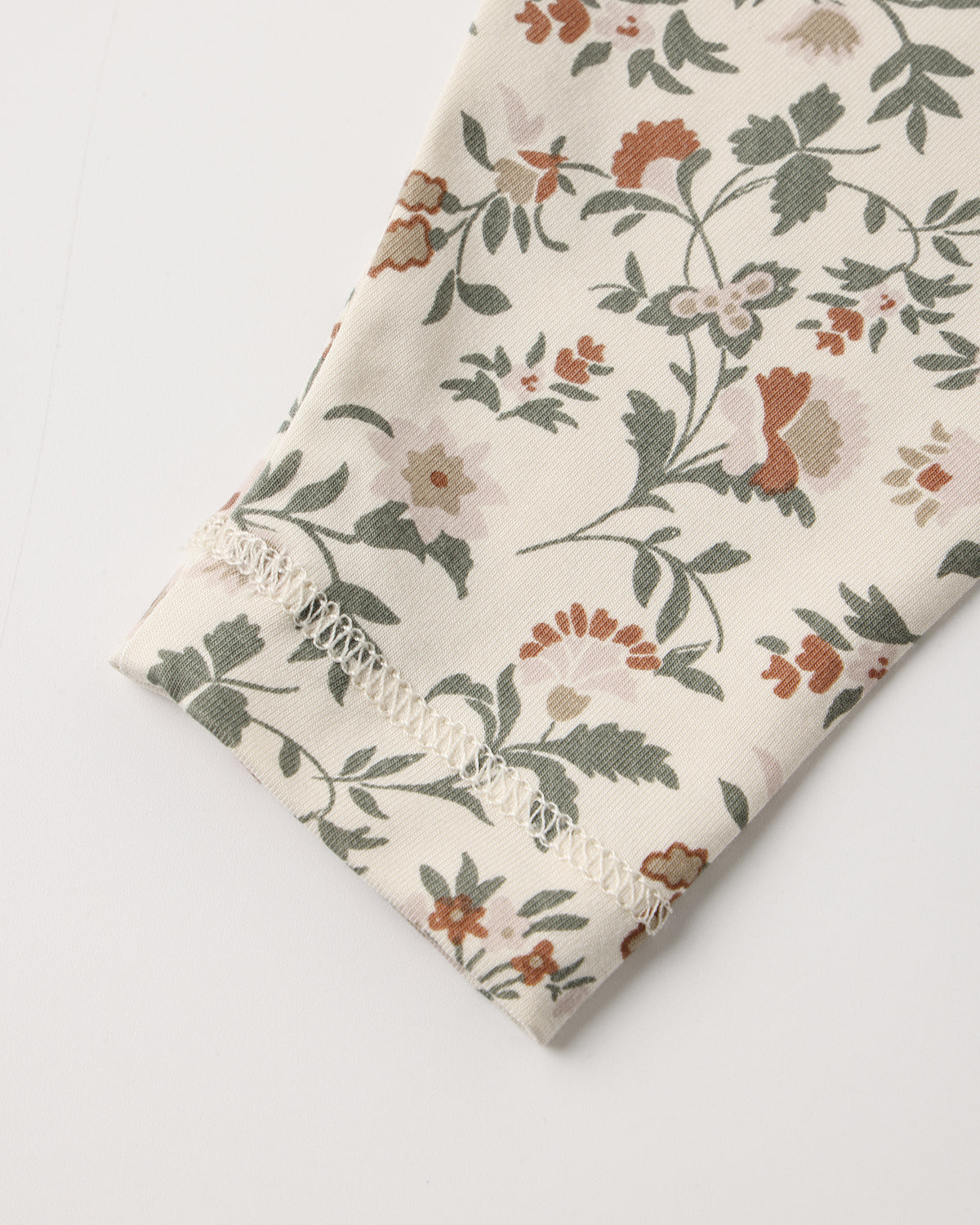 Quincy Mae Baby Bamboo Pajama Set in Holiday Floral cuff details