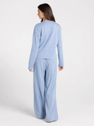 Studio model photo of rear side of Thread & Supply Ellery Pajama Set | Blue Stripe