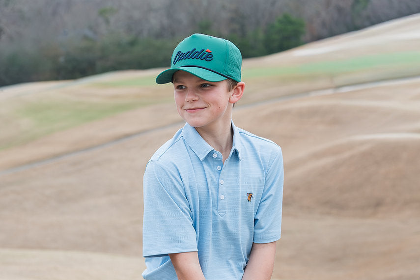Youth Caddie Performance Rope Hat | Green & Navy lifestyle model photo