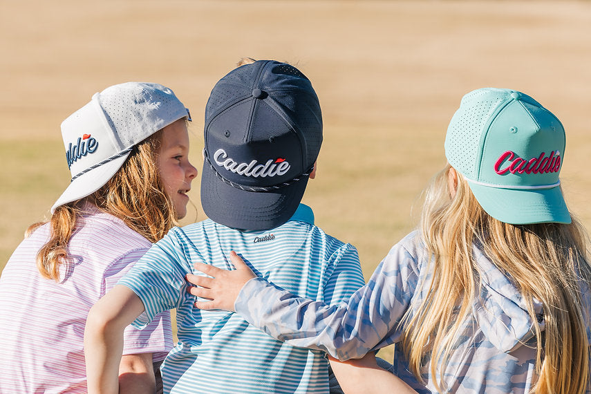 Youth Caddie Performance Rope Hat | White & Navy lifestyle model photo, back to camera angle