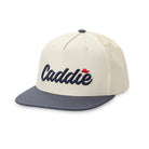 Youth Solid Bill Hat in White & Navy by Caddie flat lay