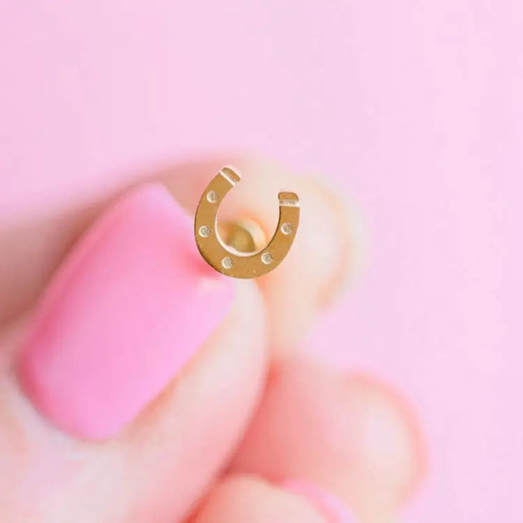 Close up view of Pierced Co. Lucky You Horseshoe Earring