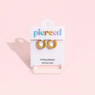 Pierced Co. Zebra Stripe Huggies Earrings flat lay in packaging