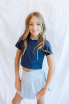 parfum de fit pleaded skirt in frost blue with outfit 